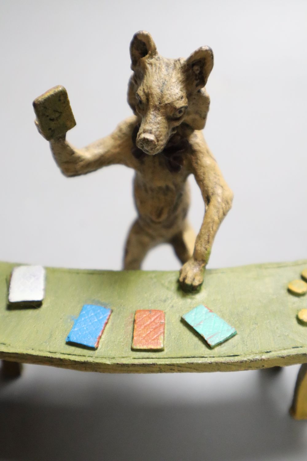 A Bergman style cold painted bronze comical fox playing at a table, indistinctly signed, width 10.5cm and a cold painted bronze elephan